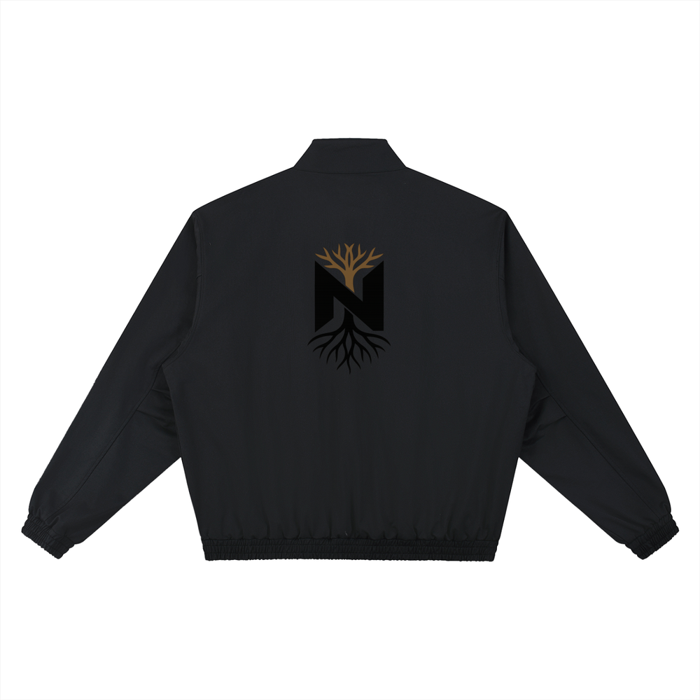 Black athletic jacket with gold tree and black roots logo on the back