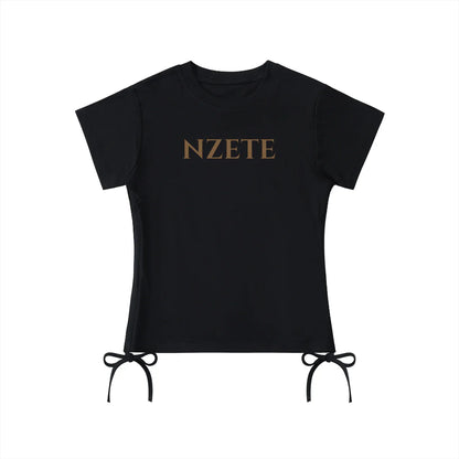 Black athletic t-shirt with NZETE logo and side tie details, short sleeves, flat lay
