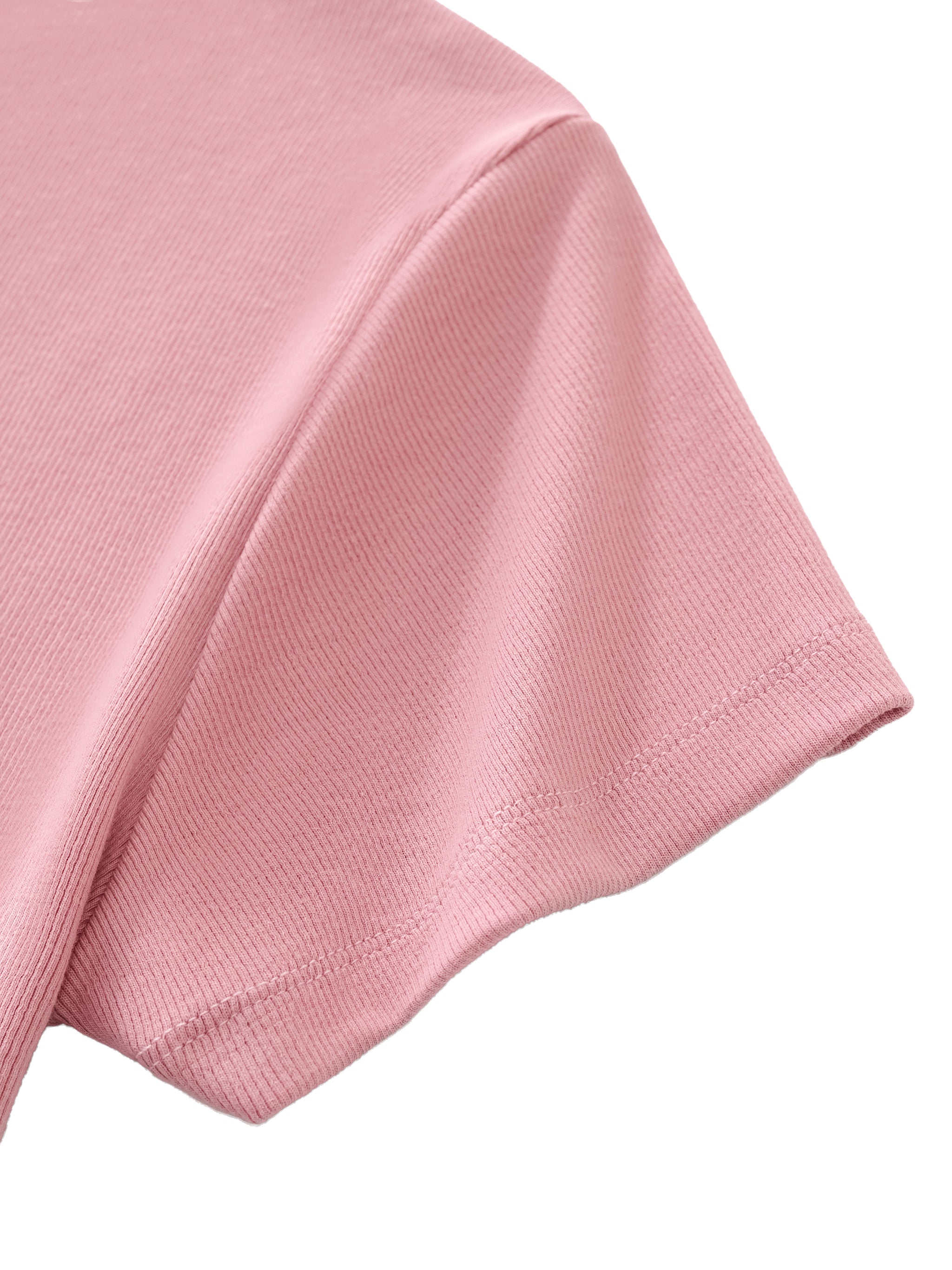 Close-up of pink athletic t-shirt sleeve with ribbed texture on white background