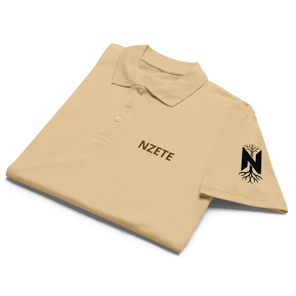 Folded sand-colored unisex premium polo shirt with logo and tree design on sleeve